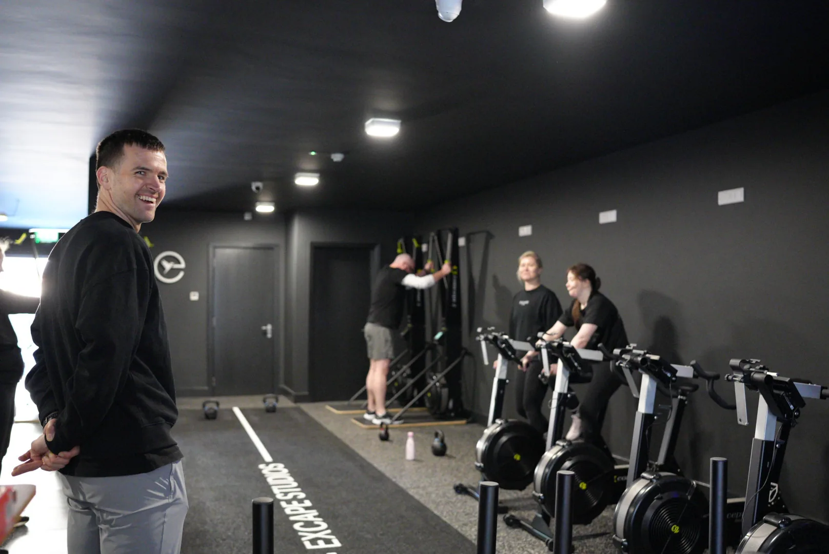 An Excape coach running a floor session
