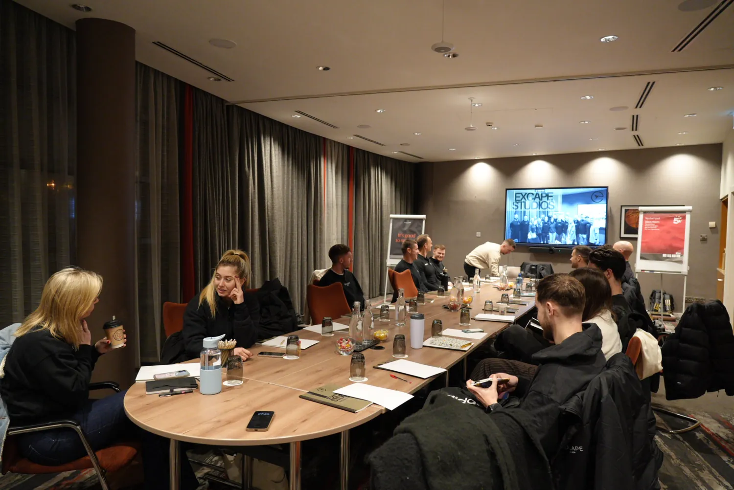 The Excape team working through a session together at a development day