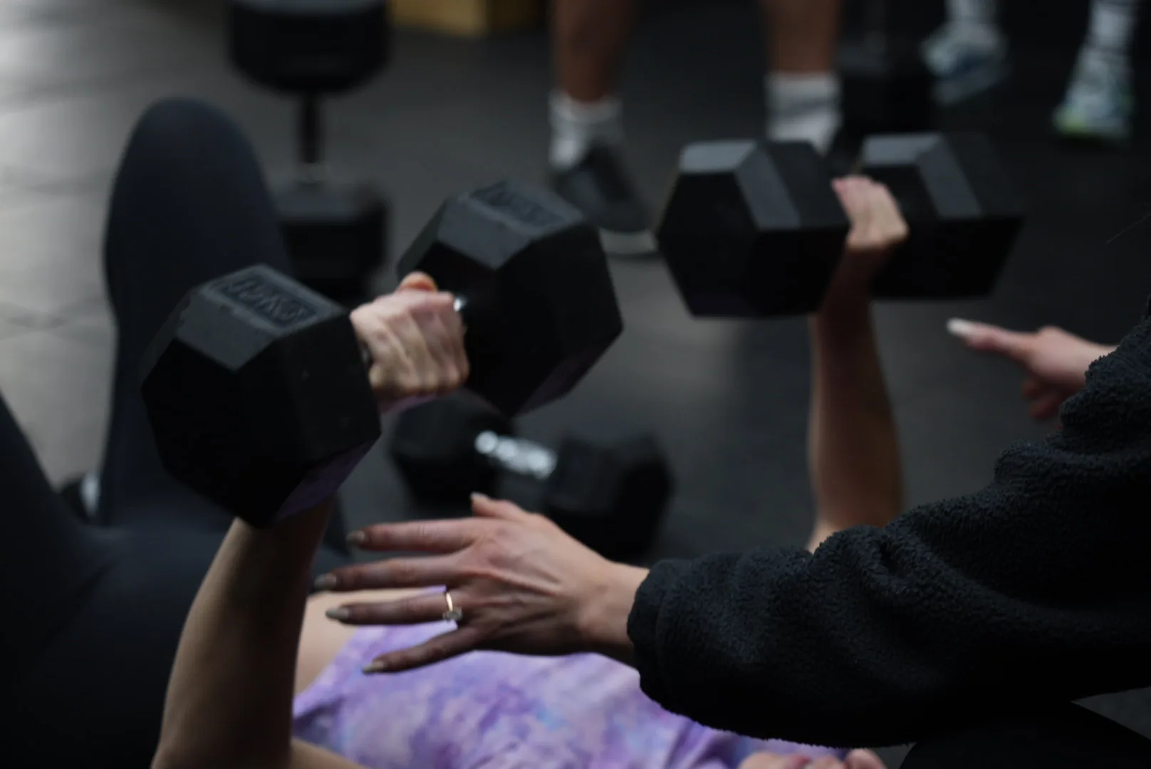 Members working through a dumbbell set at Excape Portmarnock