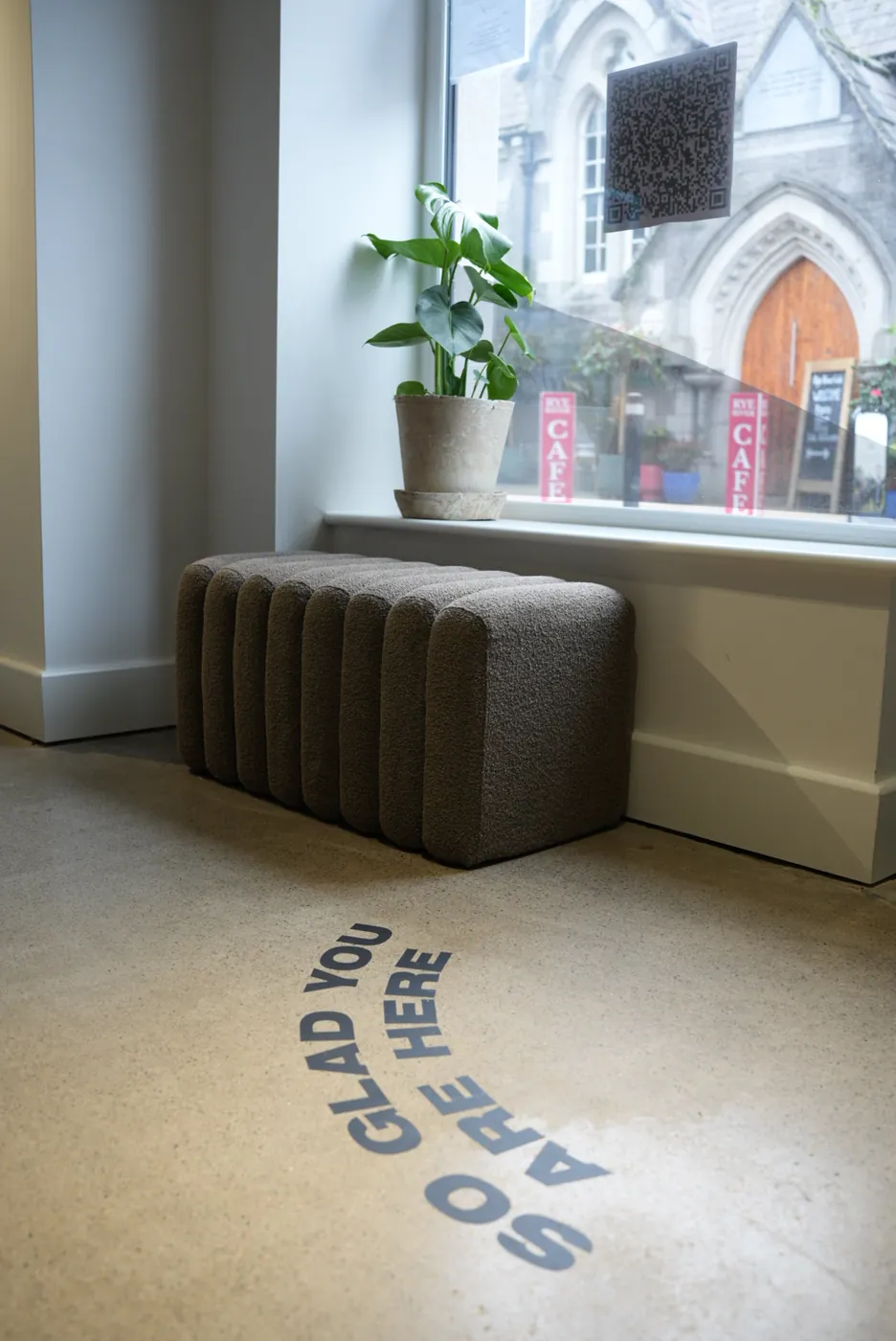 The So Glad You Are Here floor graphic in the Excape Kilcock reception